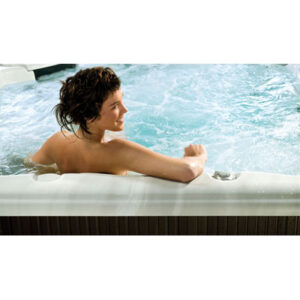 picture of woman in hot tub, taken from back