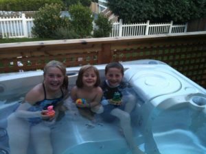3 children in limelight hot tub