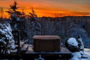 covered hot tub in a snowy mountain