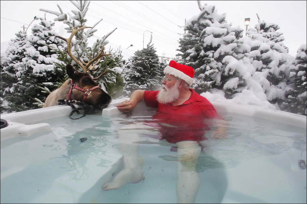 Santa with reindeer in hot tub