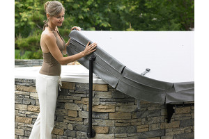 woman removing hot tub cover
