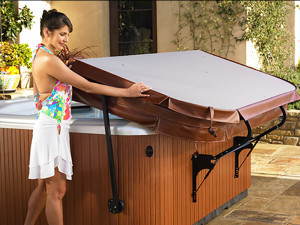 woman removing hot tub cover