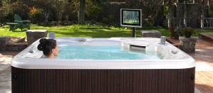 woman watching TV in hot tub