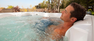 man relaxing in hot tub