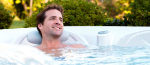 man smiling in hot tub