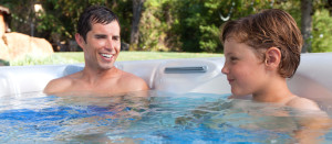 father and son in hot tub