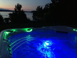 lighted hot tub at sunset