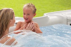 mother and kid in hot tub