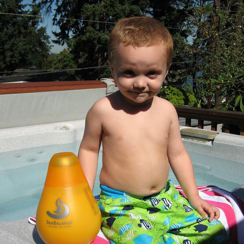 little boy with a SilkBalance bottle