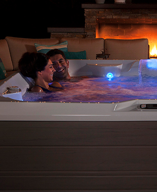 couple inside limelight pulse hot tub