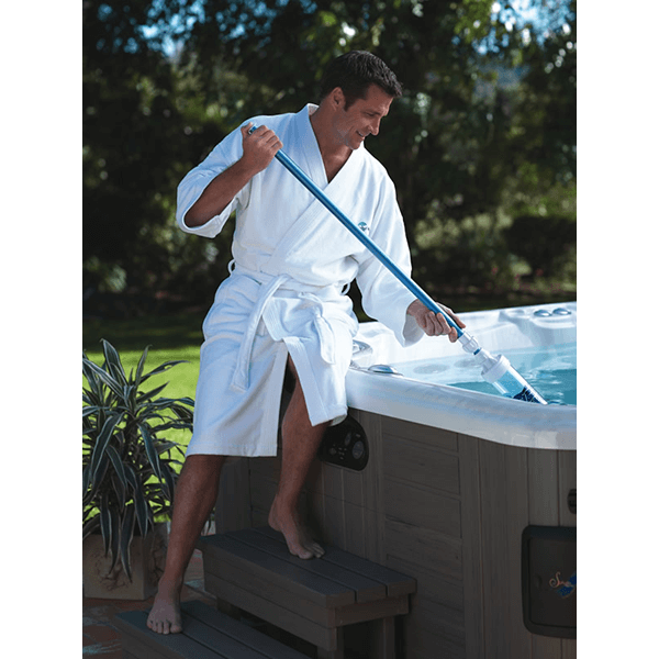 Man using the Hot Spring Spas Vac in his hot tub